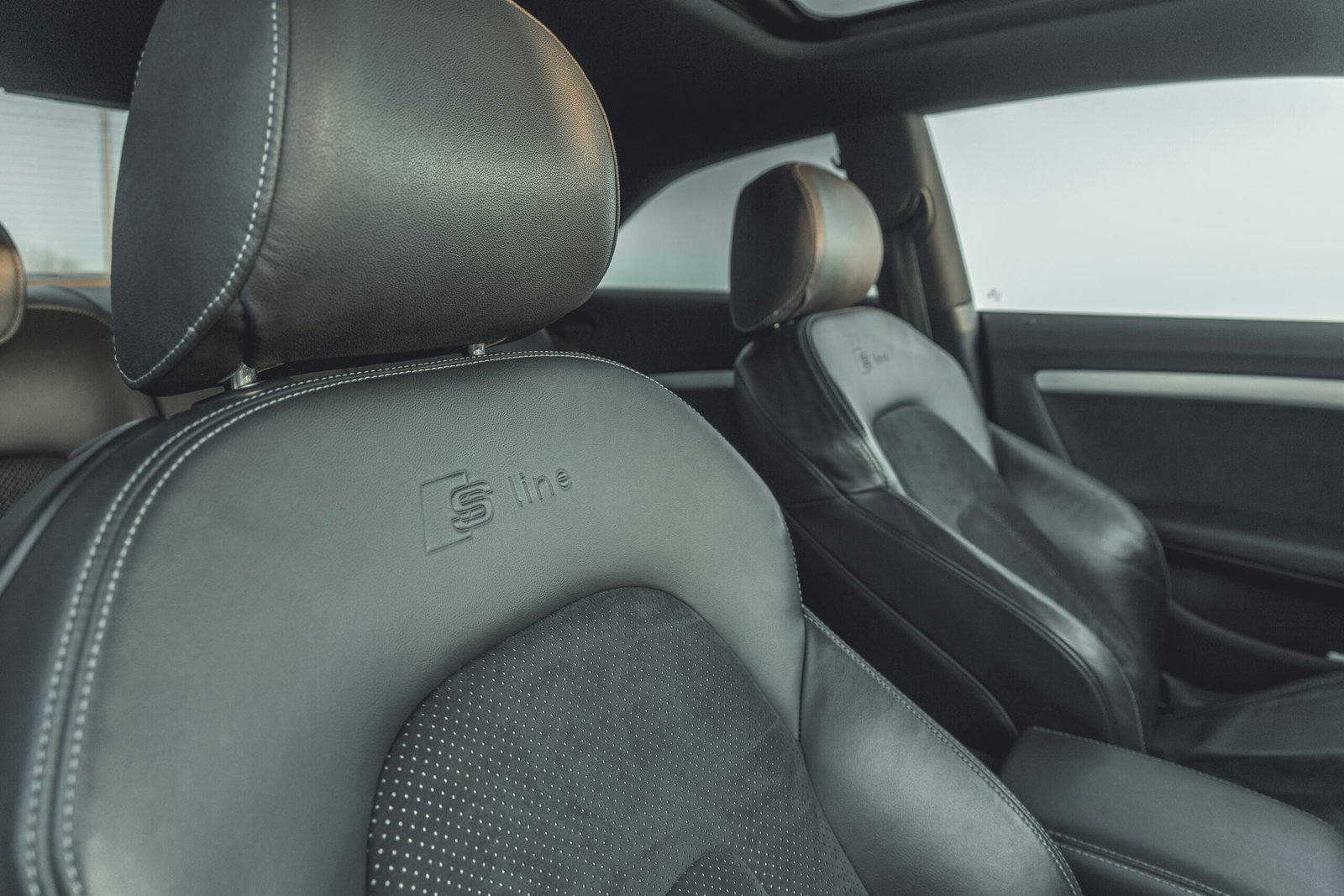 black car seat and steering wheel